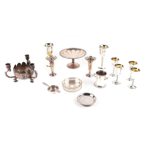 413 - A quantity of silver plated items to include vases, goblets and boxed cutlery.