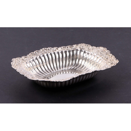 416 - A sterling silver bowl with foliate border. 18cm wide. 102g