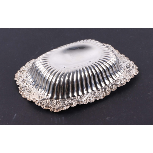 416 - A sterling silver bowl with foliate border. 18cm wide. 102g