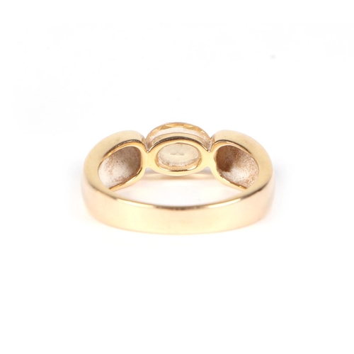 432 - A 15ct gold ring set with a pale oval Citrine, approx UK size P, 4.9g.