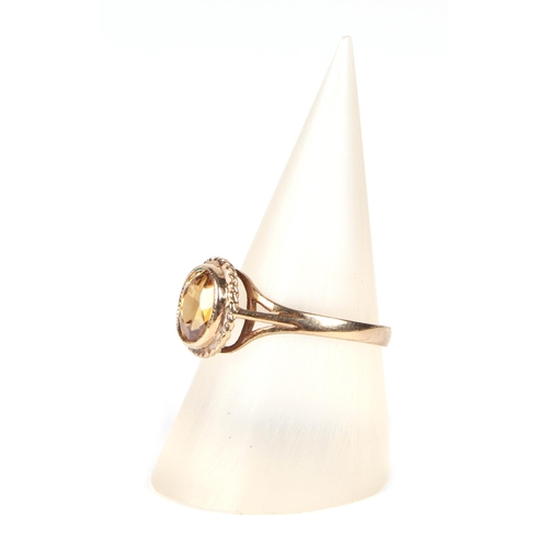 447 - A 9ct gold Citrine ring, approx UK size N, 2.1g.