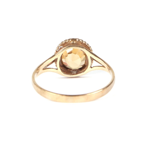 447 - A 9ct gold Citrine ring, approx UK size N, 2.1g.