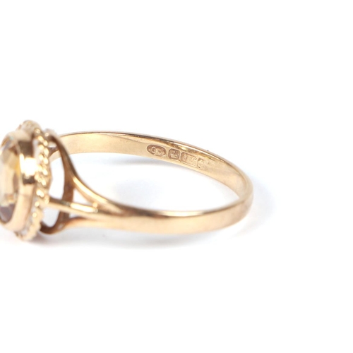 447 - A 9ct gold Citrine ring, approx UK size N, 2.1g.