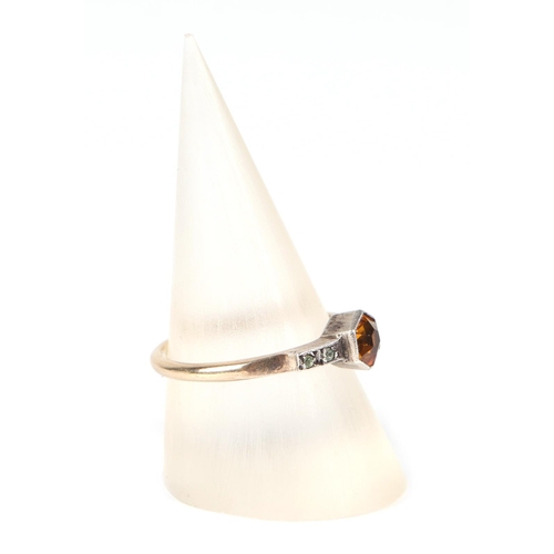 452 - A 9ct gold and silver ring set with a central Citrine, approx UK size O, 1.8g.