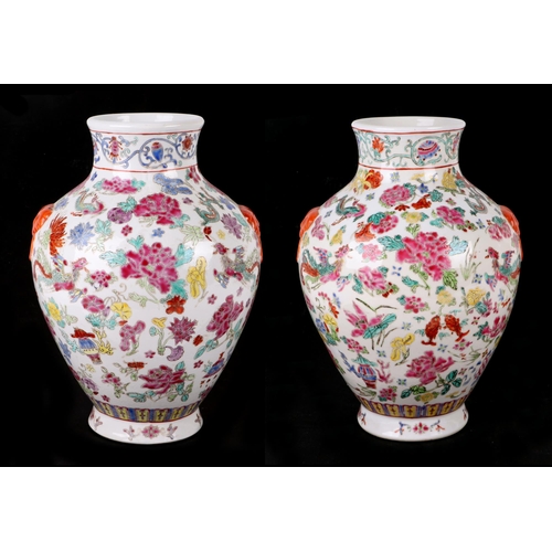 494 - A pair of Chinese famille rose baluster vases decorated with phoenix, fish and flowers, four charact... 