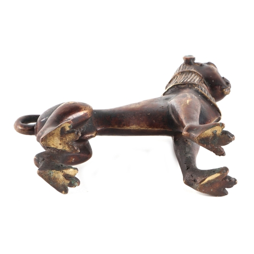 495 - An Egyptian bronze figure depicting a sphinx with stylised human head on a lions body, 17cms long.