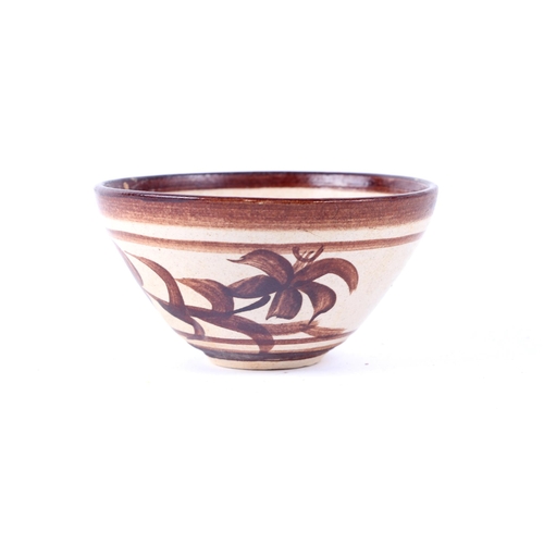 504 - A Chinese pottery bowl decorated with flowers, 11cms diameter; together with another similar (2).