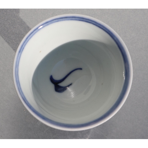 507 - A Chinese blue & white stem cup decorated with fish, six character blue mark to the underside, 8cms ... 