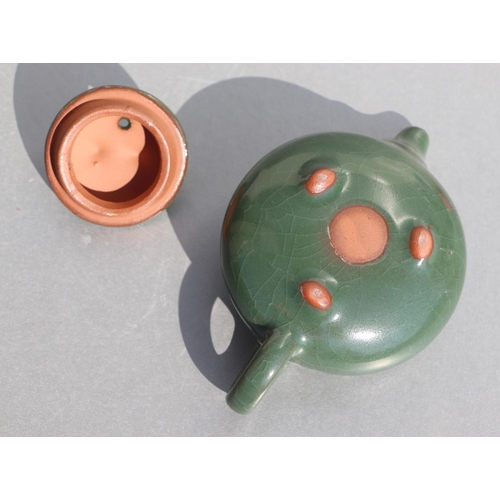 508 - A Chinese monochrome green glazed pottery teapot of compressed globular form, 14cms long.