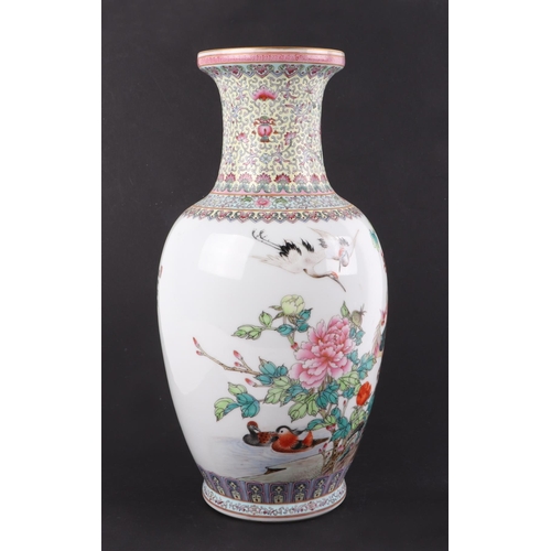 512 - A Chinese Republic style baluster vase decorated with peacocks and calligraphy, 35cms high.