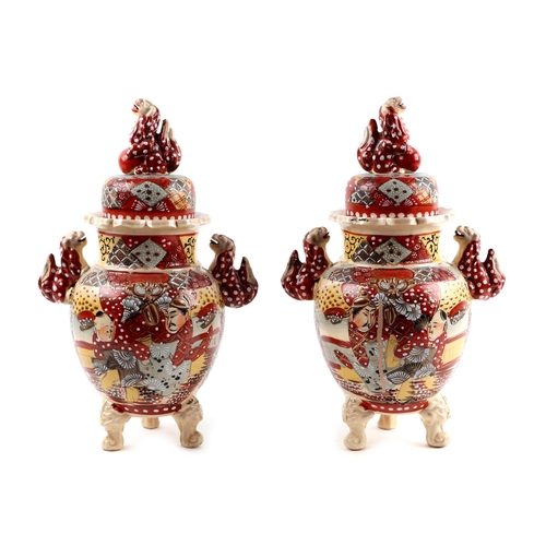 515 - A pair of late 19th century Japanese Satsuma twin-handled vases and covers, 32cms high.