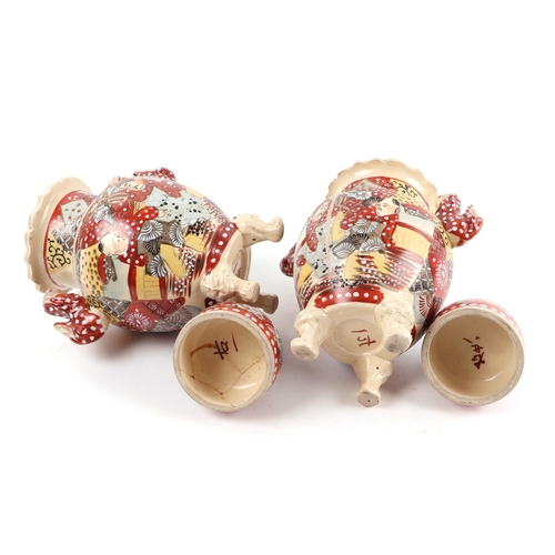 515 - A pair of late 19th century Japanese Satsuma twin-handled vases and covers, 32cms high.