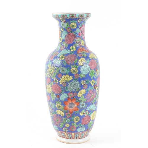 520 - A Chinese millefiori style baluster vase decorated with flowers on a blue ground, 31cms high.