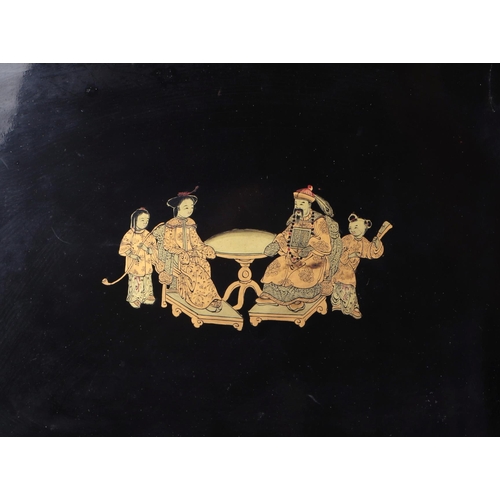 533 - A Chinese black lacquer box with gilt decoration depicting wise men within a landscape, 28cms wide; ... 