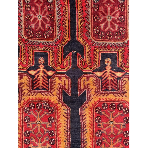 57 - A Persian hand knotted woollen Azari runner with repeating geometric medallions within repeating bor... 