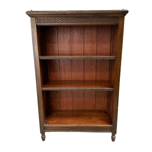 587 - A Victorian mahogany open bookcase, the three-quarter gallery above a blind fret frieze and three sh... 