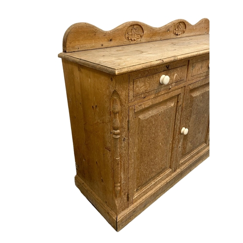 635 - A modern pine dresser base or sideboard with three frieize drawers above three cupboards, on a plint... 