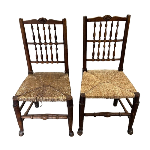 643 - A set of four North Country rush seated chairs with spindle backs.