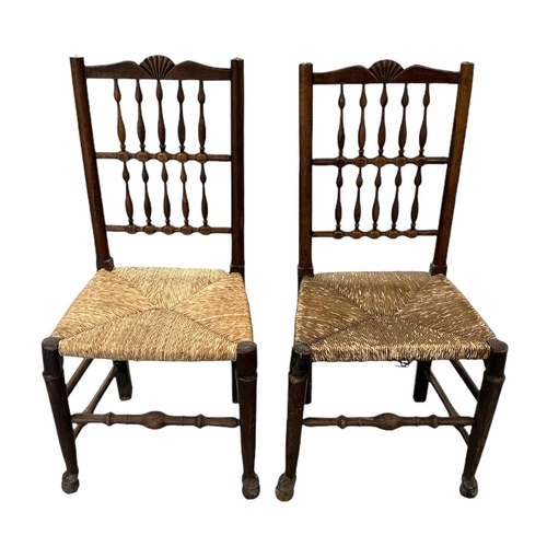 643 - A set of four North Country rush seated chairs with spindle backs.