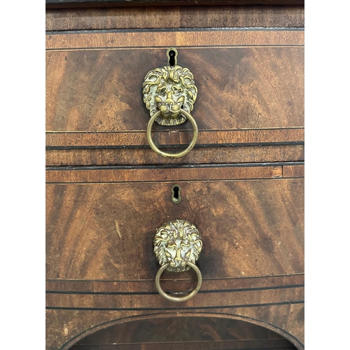 649 - An early 19th century figured mahogany sideboard with an arrangement of four drawers and two cupboar... 