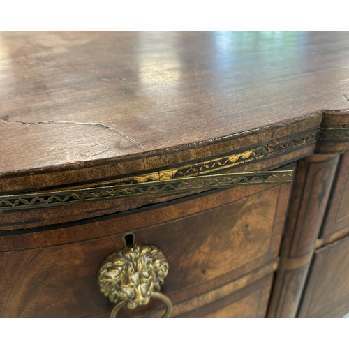 649 - An early 19th century figured mahogany sideboard with an arrangement of four drawers and two cupboar... 