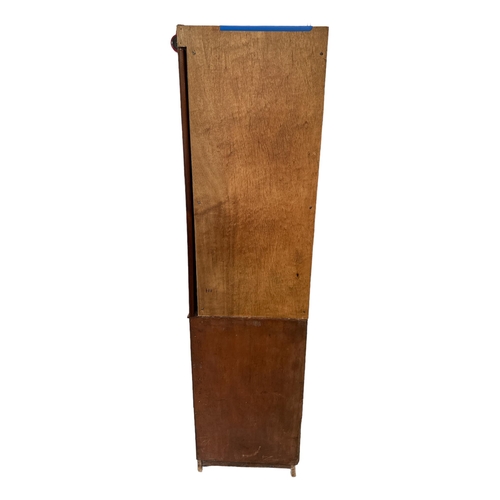 665 - A Victorian mahogany linen press (centre section of a compactum wardrobe), the pair of panelled door... 