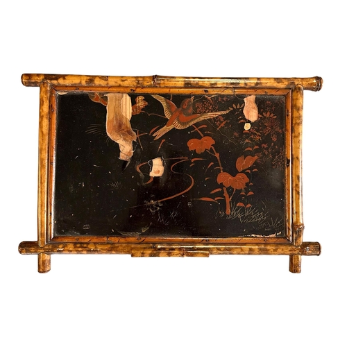 669 - A late 19th century Aesthetic period bamboo work table with lacquer panels, 45cms wide.