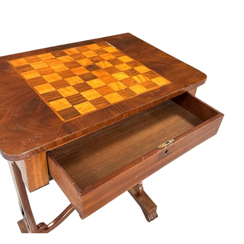 673 - A 19th century work table with inlaid chess board top above a frieze drawer and silk lined well, on ... 