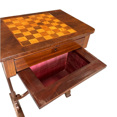 673 - A 19th century work table with inlaid chess board top above a frieze drawer and silk lined well, on ... 