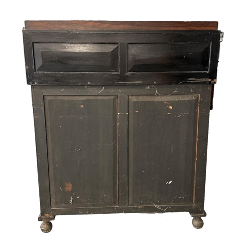 678 - An early 19th century rosewood chiffonier with two frieze drawers above a pair of panelled doors, on... 