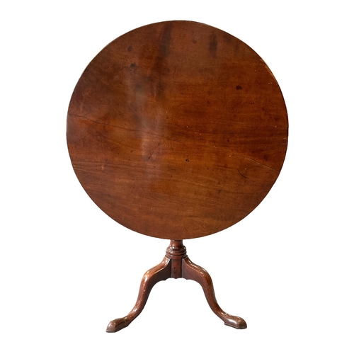 693 - A 19th century mahogany tilt-top occasional table on turned column and tripod base, 82cms diameter.