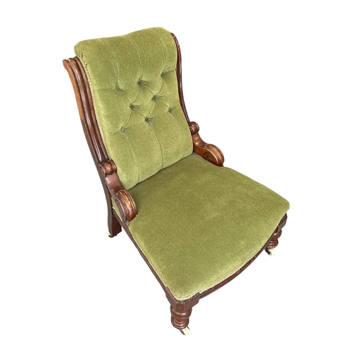 694 - A Victorian button back upholstered nursing chair.