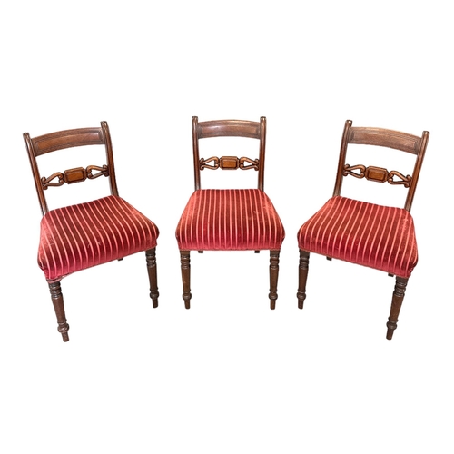 702 - A set of six Regency mahogany dining chairs with upholstered stuff-over seats, on turned front suppo... 