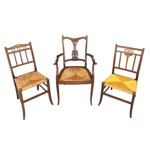 703 - Two Edwardian inlaid bedroom chairs with rush seats; together with a similar elbow chair; a walnut o... 