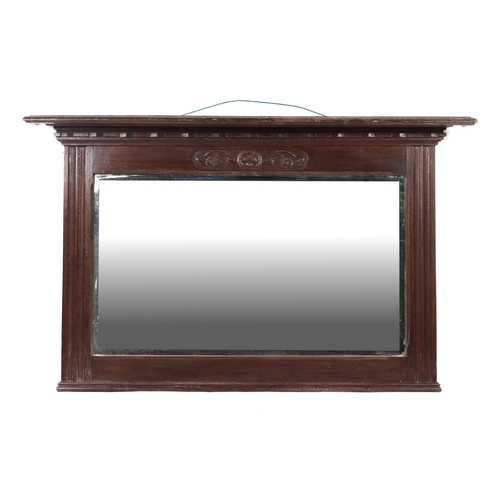 713 - A late Victorian carved oak overmantle mirror with bevel edged rectangular plate, 122cms wide.