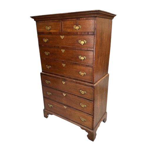 726 - A 19th century oak chest on chest with mahogany crossbanding, the upper section with moulded cornice... 