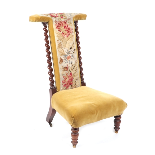 717 - A 19th century rosewood framed prie dieu chair with needlework upholstered back panel, barleytwist s... 