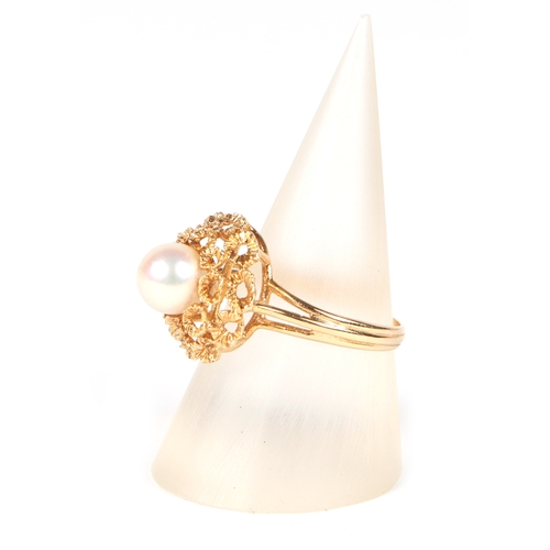 486 - An 18ct gold ring set with a central pearl, approx UK size M, 4g.