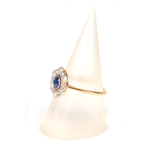 490 - An 18ct gold and platinum diamond and sapphire cluster ring, approx UK size L, 1.9g.