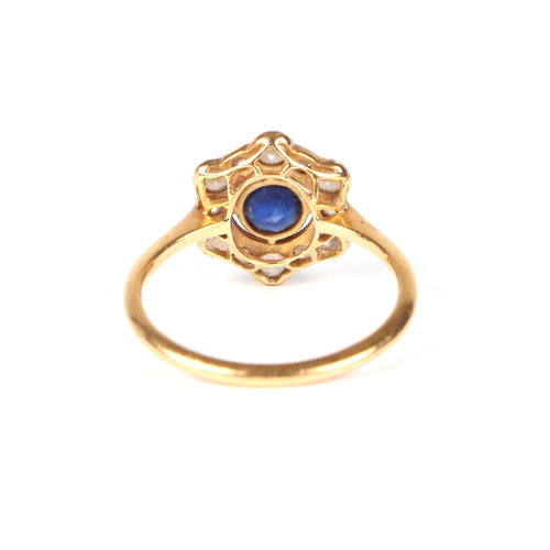 490 - An 18ct gold and platinum diamond and sapphire cluster ring, approx UK size L, 1.9g.