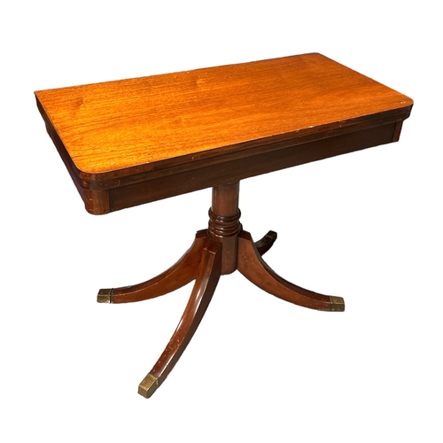 606 - A mahogany tea table on turned column and quatrefoil base, 92cms wide.