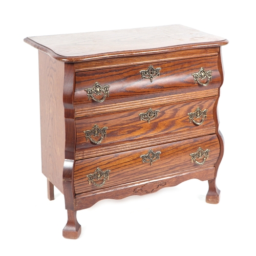 595 - A continental oak chest with three long drawers of small proportions, 63cms wide.