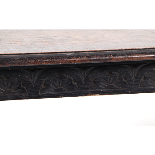 604 - A late 19th century carved oak window seat, 107cms wide.