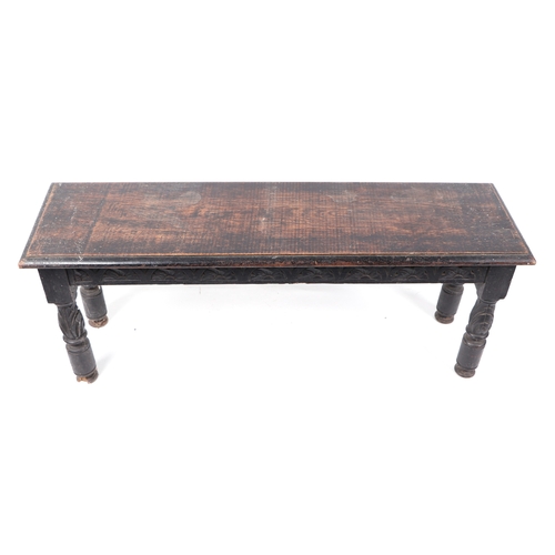 604 - A late 19th century carved oak window seat, 107cms wide.