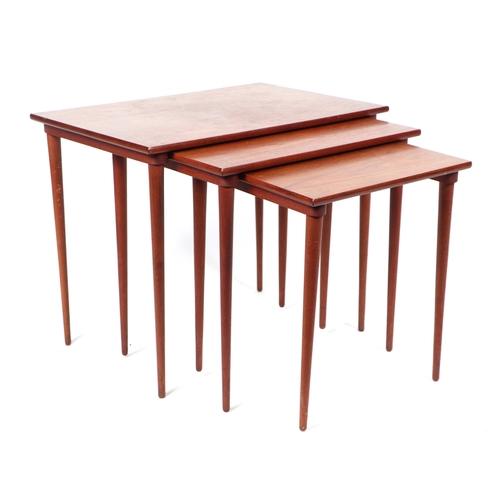 748 - Mid century modern:  a nest of three teak side tables with rectangular tops on slender tapering legs... 