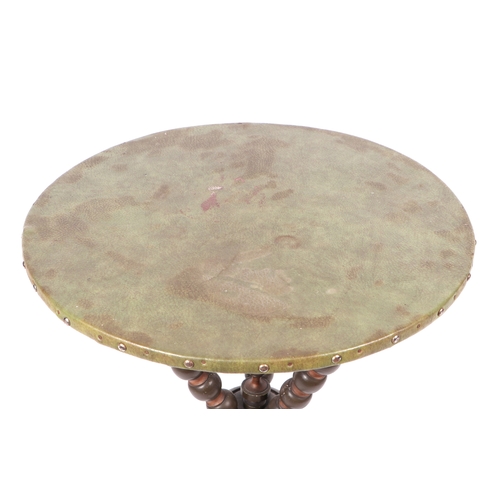 653 - A Gypsy type tripod table with circular green leather top, on bobbin turned legs joined by a central... 