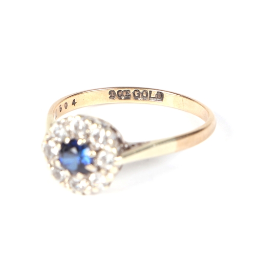 450 - A 9ct gold cluster ring with central blue stone, approx UK size R, 2.6g.