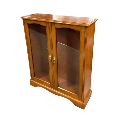 714 - A modern oak side cabinet with three frieze drawers above an open two-tier bookshelf, 90cms wide; to... 