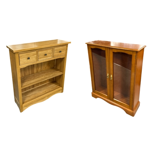 714 - A modern oak side cabinet with three frieze drawers above an open two-tier bookshelf, 90cms wide; to... 