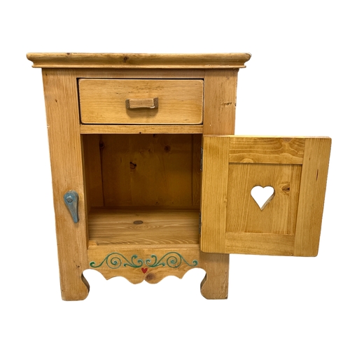 571 - A pair of Scandinavian pine bedside cupboards with painted decoration and single frieze drawer with ... 